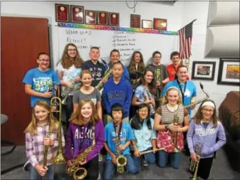  ?? SUBMITTED PHOTO ?? Kutztown Middle School student Blake Nolte, in back, with Carl Zeplin’s 7th grade jazz band homeroom class. They were the winning class in the spare change fundraiser for hurricane victims in Puerto Rico.