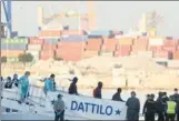  ?? PAU BARRENA / AFP ?? Migrants disembark from the Italian navy boat Dattilo in Valencia on Sunday.