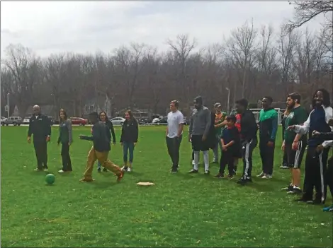  ?? TAWANA ROBERTS — THE NEWS-HERALD ?? Heritage Middle School special-needs students played a game of kickball with Lake Erie College students on campus at Jack Slattery Field on April 5.