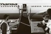  ?? Felix Schmitt / New York Times ?? A Lufthansa flight is loaded with cargo in Germany because ticket sales are down during the coronaviru­s pandemic.