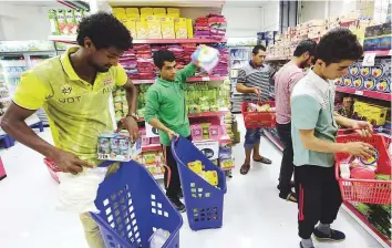  ?? Atiq ur Rehman/Gulf News ?? Customers shop for combo deals and products offered at discounts, at Al Hara Al Shamia Supermarke­t on Jamal Abdul Nasser street in Sharjah on Wednesday.
