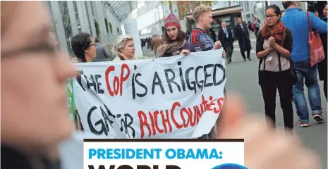  ?? CHRISTOPHE ENA, AP ?? Activists hold a banner at the United Nations climate change conference Tuesday in Le Bourget, north of Paris.