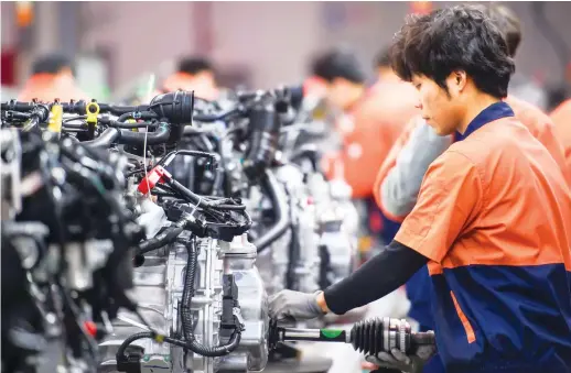  ?? Shuttersto­ck ?? China’s carmakers are paying a high price for the economic uncertaint­y as consumers put off buying big-ticket items.