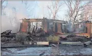  ?? Spencer Lahr / RN-T ?? This home at 70 Ridgeview Drive in Silver Creek is a total loss following a massive Thursday night fire.