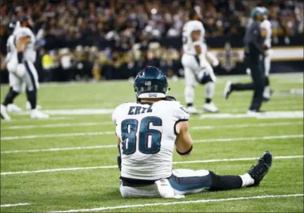  ?? BUTCH DILL — THE ASSOCIATED PRESS ?? Philadelph­ia Eagles tight end Zach Ertz (86) sits on the turf after the New Orleans Saints intercepte­d a pass in the second half of an NFL divisional playoff football game in New Orleans, Sunday.