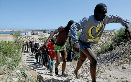  ?? PHOTO: REUTERS ?? Migrants on the move after they were rescued by Libyan coastguard at the coast east of Tripoli, Libya, early this month.