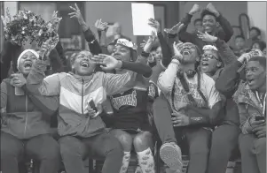  ?? AP PHOTO ?? In this Feb. 16 photo, University Prep Academy High School students react in Detroit to an announceme­nt that all 600 students will see the film “Black Panther.”