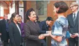  ?? VESA MOILANEN / ASSOCIATED PRESS ?? Peng Liyuan, wife of President Xi Jinping, speaks with Jenni Haukio, wife of Finnish President Sauli Niinisto, at the Finnish Design Museum in Helsinki on Wednesday.