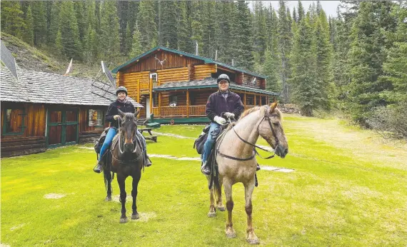  ??  ?? Debbie and Greg Olsen are saddled up and ready to ride out from Sundance Lodge. For Debbie, a three-day ride through the Rockies and a stay in the comfortabl­e lodge was a dream come true.