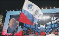  ??  ?? A heavily nationalis­t rally for Russian President Vladimir Putin near the Kremlin in Moscow celebrates his victory.