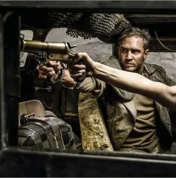  ??  ?? “Mad Max: Fury Road” stars Tom Hardy as Max Rockatansk­y and Charlize Theron as Imperator Furiosa. The film is nominated for 10 Academy Awards.