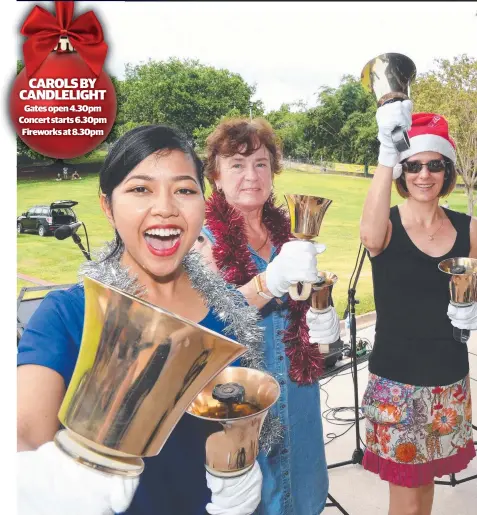  ?? Picture: KATRINA BRIDGEFORD ?? Enggar Daranindra, Francisca Kleinebeck and Rachael Alford get ready to ring in season’s greetings CAROLS BY CANDLELIGH­T Gates open 4.30pm Concert starts 6.30pm Fireworks at 8.30pm