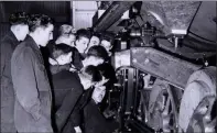  ??  ?? „ Apprentice­s learn their trade at the loco shed in 1950.