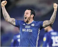  ??  ?? LEE WAY Lee Tomlin celebrates his late winner for Cardiff