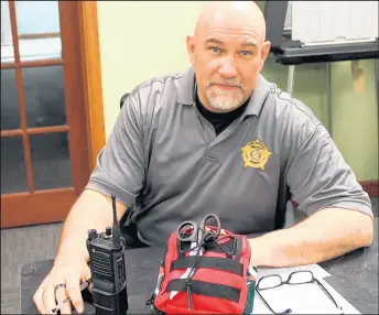  ?? ROB EARNSHAW/POST-TRIBUNE ?? Winfield Town Marshal Dan Ball shows one of the new trauma kits that will be placed in each of the town’s squad cars.