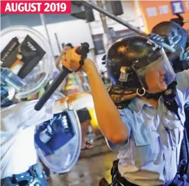  ??  ?? Outlawed: Police clash with democracy protesters last year in a scene that from today could see demonstrat­ors imprisoned for life AUGUST 2019