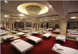  ?? — AP ?? A view of banquet hall converted into an isolation faclity for Covid -19 patients in New Delhi on Tuesday.