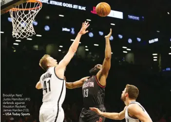  ?? — USA Today Sports ?? Brooklyn Nets’ Justin Hamilton (41) defends against Houston Rockets’ James Harden (13).