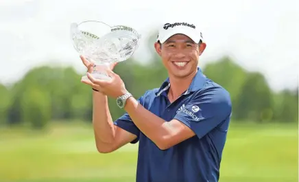  ?? JOSEPH MAIORANA/USA TODAY SPORTS ?? Collin Morikawa holds his trophy after winning the Workday Charity Open golf tournament Sunday at Muirfield Village Golf Club.