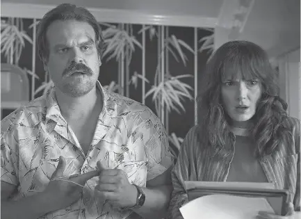  ??  ?? Chief Hopper (David Harbour) and Joyce (Winona Ryder) have their hands full in Season 3 of “Stranger Things.” NETFLIX