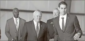  ?? Kevin Myrick / SJ ?? State Rep. Trey Kelley (right) leads Gov. Nathan Deal to the podium before the start of a ceremony to sign the state’s 2018 amended budget at Polk County’s airport.