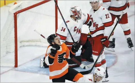  ?? MATT SLOCUM — THE ASSOCIATED PRESS ?? The fast start to the season by Travis Konecny, left, celebratin­g a goal Tuesday night against Carolina, and his fellow Flyers youngsters has validated new coach Alain Vigneault’s faith in a youthful core.