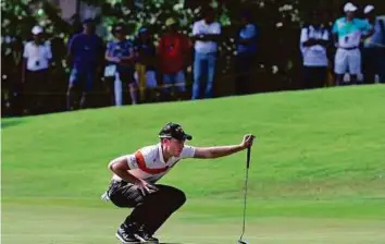  ?? AP ?? Danny Willett of England lines up his putt on the second hole during the Maybank Championsh­ip in Kuala Lumpur yesterday.