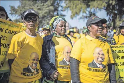  ?? Photo: Guillem Sartorio/afp ?? Defiant response: Supporters of former president Jacob Zuma gather outside the Zondo commission in 2019. Zuma has since flouted three summonses to appear before the inquiry.