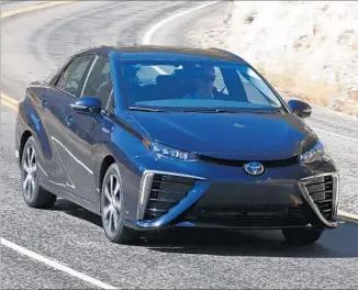  ?? Myung J. Chun Los Angeles Times ?? TOYOTA’S MIRAI looks like a Camry, dressed up with sporty wheels and racier side lines. Its 113-kilowatt motor makes the equivalent of 151 horsepower and 247 pound-feet of torque.