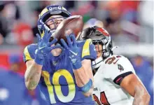  ?? NATHAN RAY SEEBECK/USAT ?? Wide receiver Cooper Kupp makes a catch to set up the final field goal in the Rams’ 30-27 victory over the Buccaneers on Saturday.