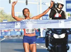  ?? Ahmed Kutty/Gulf News ?? Ababel Yeshaneh is all smiles as she clinches the women’s Abu Dhabi Marathon yesterday.