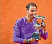  ?? — AFP ?? Spain’s Rafael Nadal celebrates with the Italian Open trophy after defeating Novak Djokovic in the final.