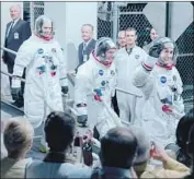  ??  ?? APOLLO 11 astronauts Corey Stoll, left, Lukas Haas and Gosling set off for history in “First Man.”