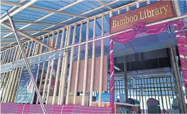  ?? PHOTOS BY KORNCHANOK RAKSASERI ?? All the school buildings, including the library, are built from bamboo. This is why the school has also been dubbed the Bamboo School.