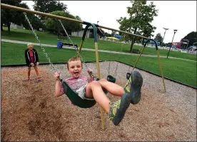  ?? NWA Democrat-Gazette/J.T. WAMPLER ?? Elizabeth Warren of Lowell pushes her grandson Seth Warren, 4, on a swing at Murphy Park in Springdale. Warren comes to the park every Tuesday to spend time with her six grandchild­ren. The city is installing security cameras in Murphy and C.L. “Charlie” and Willie George Park to deter vandalism.