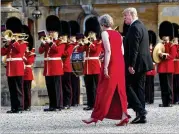  ?? DOUG MILLS / THE NEW YORK TIMES ?? British Prime Minister Theresa May escorts President Donald Trump into a gala dinner at Blenheim Palace near Oxford on Thursday. Trump is on a seven-day, threenatio­n European trip.