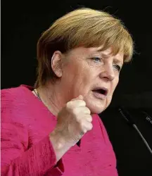  ?? Thomas Kienzle - 22.set.2017/AFP ?? Merkel discursa em comício em Ulm, no sul da Alemanha