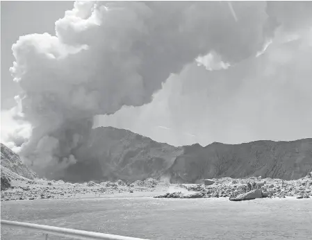  ?? MICHAEL SCHADE VIA EPA- EFE ?? An image by visitor Michael Schade shows White Island ( Whakaari) volcano, as it erupts, in the Bay of Plenty, New Zealand.