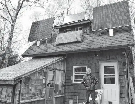  ?? FRAM DINSHAW/THE NEWS ?? John Patton of West River powers his home with solar panels and lives off the grid.