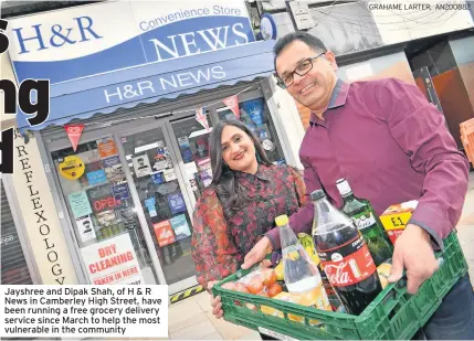  ?? GRAHAME LARTER, AN200882 ?? Jayshree and Dipak Shah, of H & R News in Camberley High Street, have been running a free grocery delivery service since March to help the most vulnerable in the community