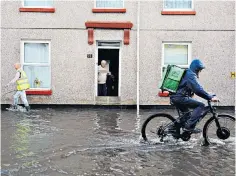  ?? ?? A street in Plymouth, Devon, yesterday after torrential rain led to flash flooding