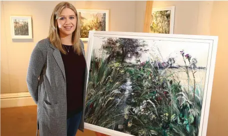  ??  ?? Inspired: Emma Spence with one of her paintings of the family farm where Nevin (right) died with his brother Graham and father Noel