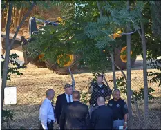  ?? DEKE FARROW/THE MODESTO BEE VIA AP ?? In this Aug. 1, photo, law enforcemen­t officers stand by the scene behind the American Budget Inn on Kansas Avenue in Modesto, Calif.