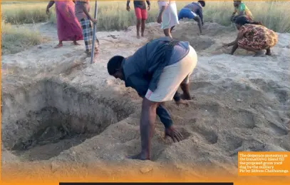  ??  ?? The desperate protestors in the Iranaithiv­u island fill the proposed grave yard dug by the military
Pic by Sithum Chathurang­a