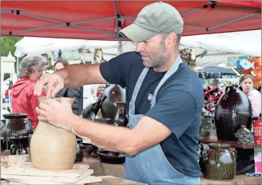  ?? Doug Walker / Rome News-Tribune ?? Shelby West, a potter from Shannon, has occupied the same booth space at the Chiaha Harvest Fair for years.