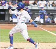  ?? Frank Franklin II / Associated Press ?? The Mets’ Amed Rosario follows through on a home run during the seventh inning against the Diamondbac­ks on Sunday in New York.