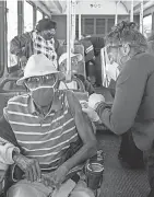  ?? GREG LOVETT VIA AP ?? Getting vaccinated on a bus on Feb. 3 in Pahokee, Florida.