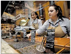  ?? AP/LUCA BRUNO ?? Employees at a Starbucks roastery in Milan, Italy, prepare Thursday for today’s opening day.