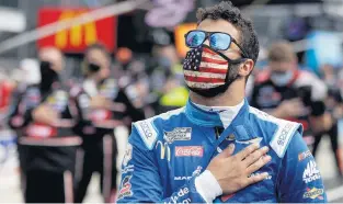  ?? DARRON CUMMINGS/ASSOCIATED PRESS ?? Bubba Wallace, the only Black driver currently at NASCAR’s top level, stands during the national anthem Sunday at Indianapol­is Motor Speedway. He has been instrument­al in NASCAR’s recent statements.