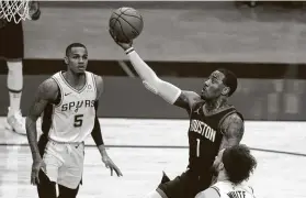  ?? Karen Warren / Staff photograph­er ?? Much has changed since Rockets guard John Wall (1) last played in his native North Carolina, and his friends and family will be unable to attend the game.